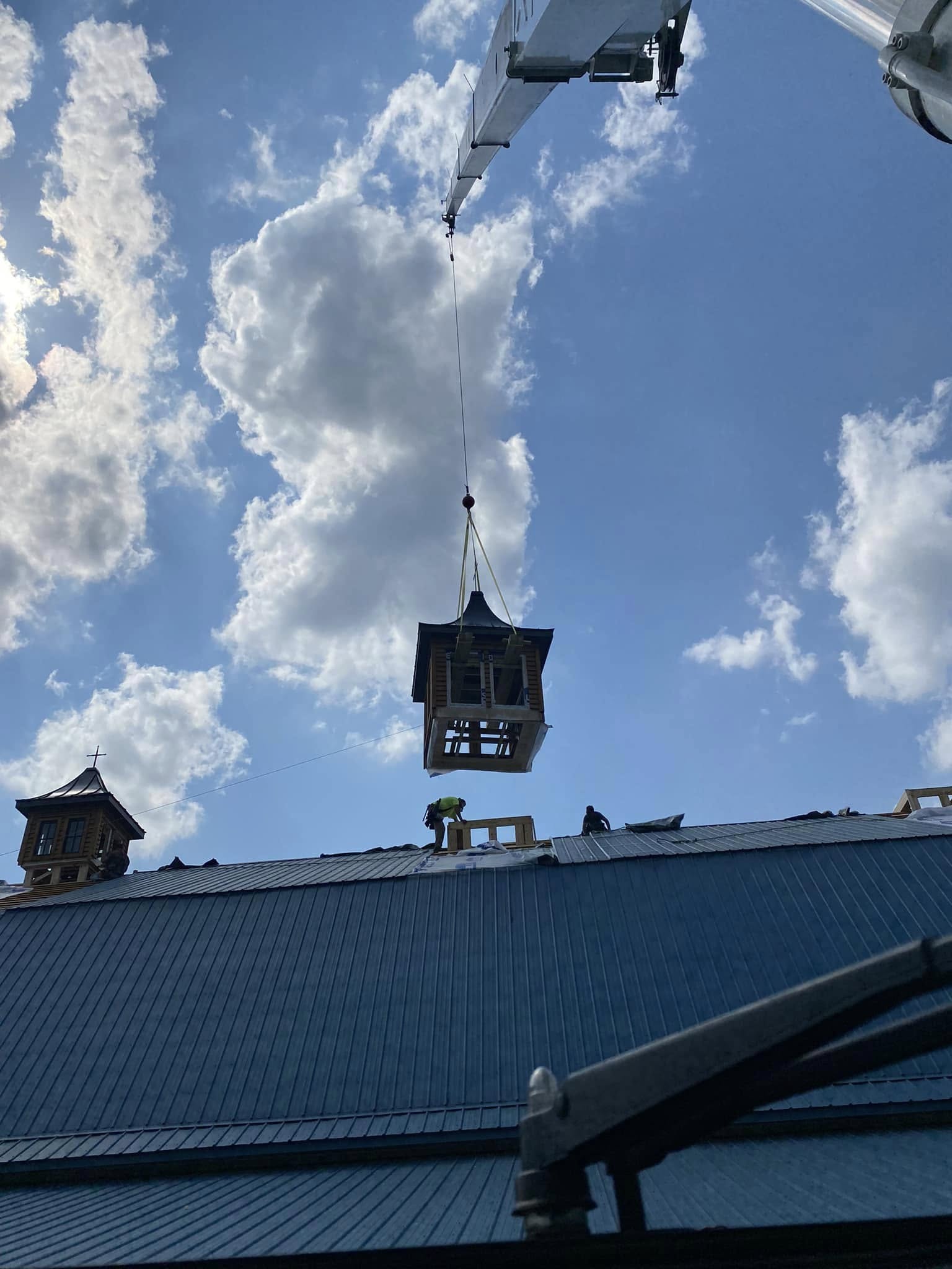 setting a cupola on church roof with crane 2