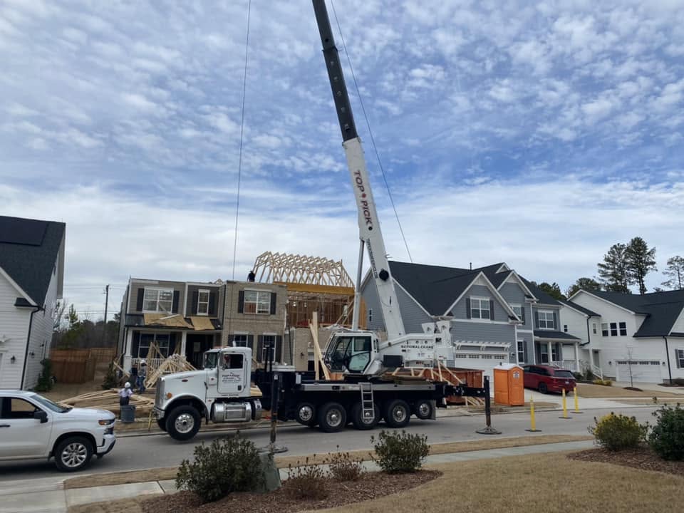 setting residential house roof trusses with crane